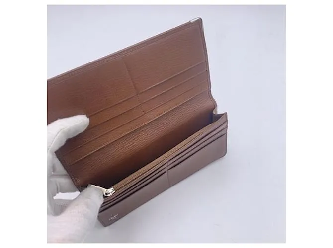 Cartier Monedero largo plegable con logo en relieve de cuero marrón Castaño 