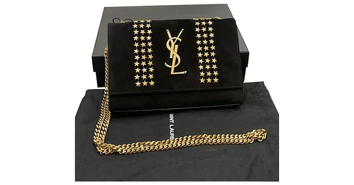 Downtown Kate con tachuelas de estrellas de ante negro de Yves Saint Laurent 