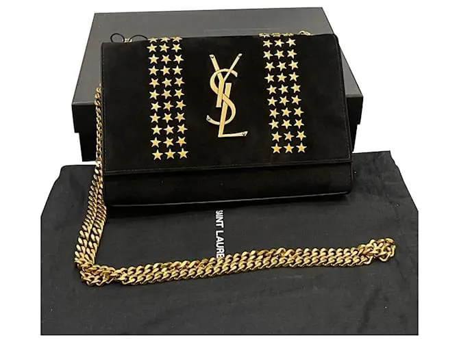 Downtown Kate con tachuelas de estrellas de ante negro de Yves Saint Laurent 