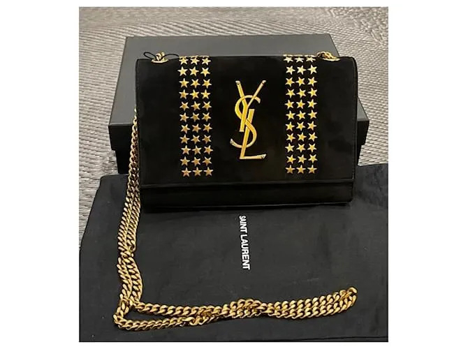 Downtown Kate con tachuelas de estrellas de ante negro de Yves Saint Laurent 