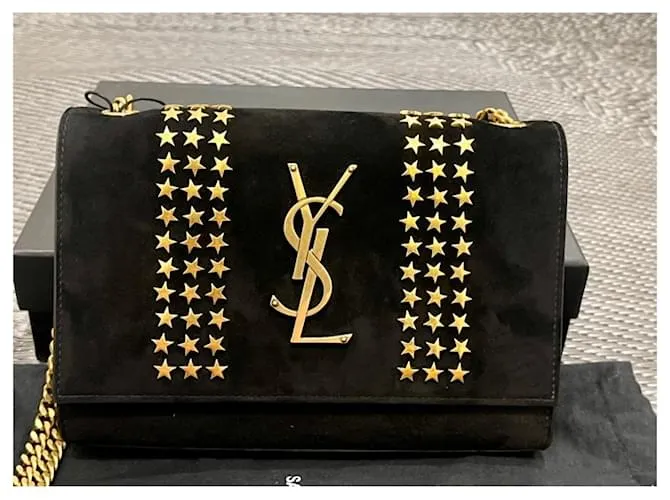Downtown Kate con tachuelas de estrellas de ante negro de Yves Saint Laurent 