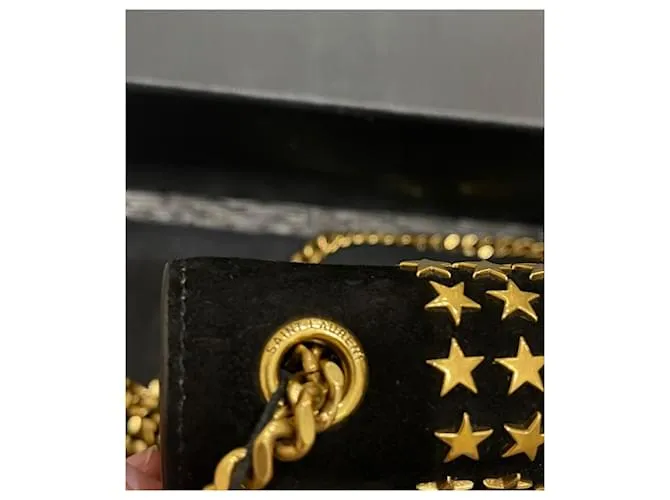 Downtown Kate con tachuelas de estrellas de ante negro de Yves Saint Laurent 