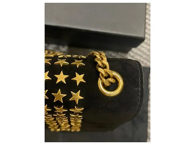 Downtown Kate con tachuelas de estrellas de ante negro de Yves Saint Laurent 