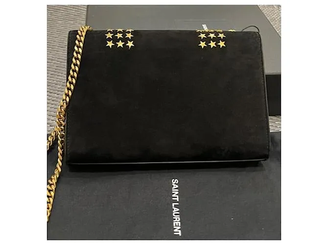 Downtown Kate con tachuelas de estrellas de ante negro de Yves Saint Laurent 