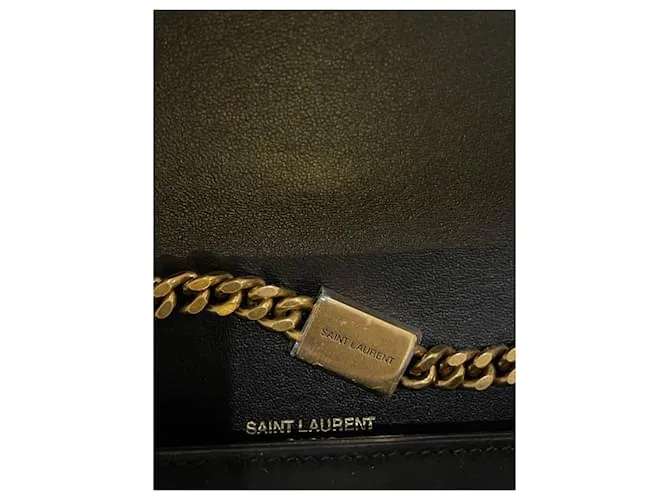 Downtown Kate con tachuelas de estrellas de ante negro de Yves Saint Laurent 