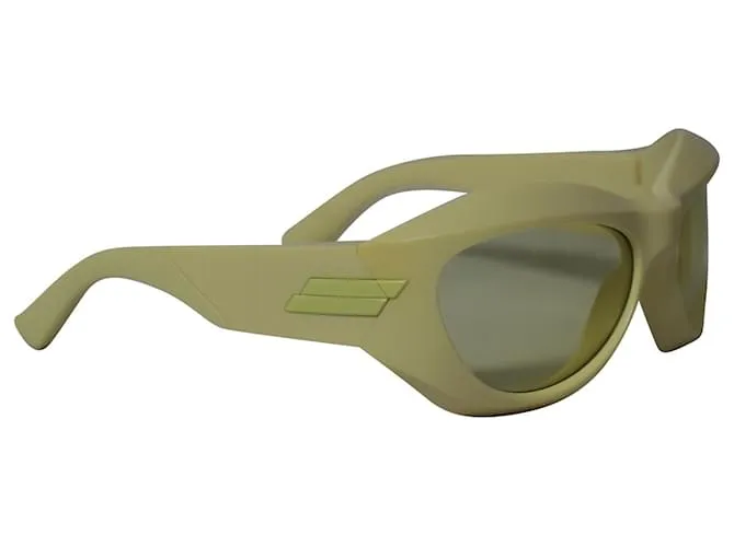 Gafas de sol redondas de inyección gruesa en acetato amarillo de Bottega Veneta 