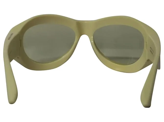 Gafas de sol redondas de inyección gruesa en acetato amarillo de Bottega Veneta 