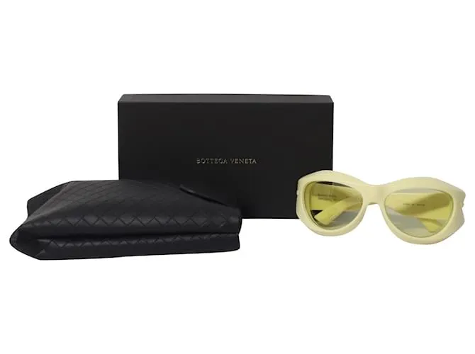 Gafas de sol redondas de inyección gruesa en acetato amarillo de Bottega Veneta 