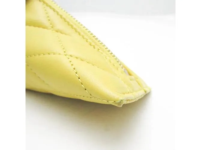 Monedero de cuero amarillo acolchado Saint Laurent 