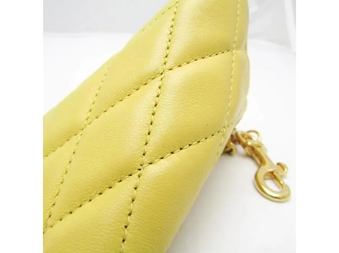 Monedero de cuero amarillo acolchado Saint Laurent 