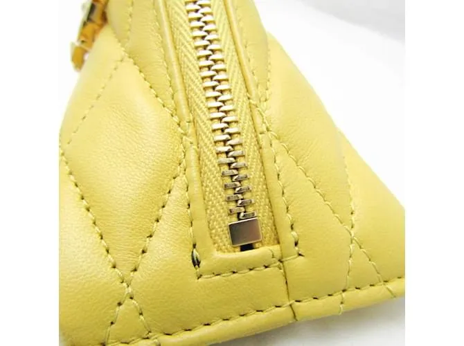 Monedero de cuero amarillo acolchado Saint Laurent 