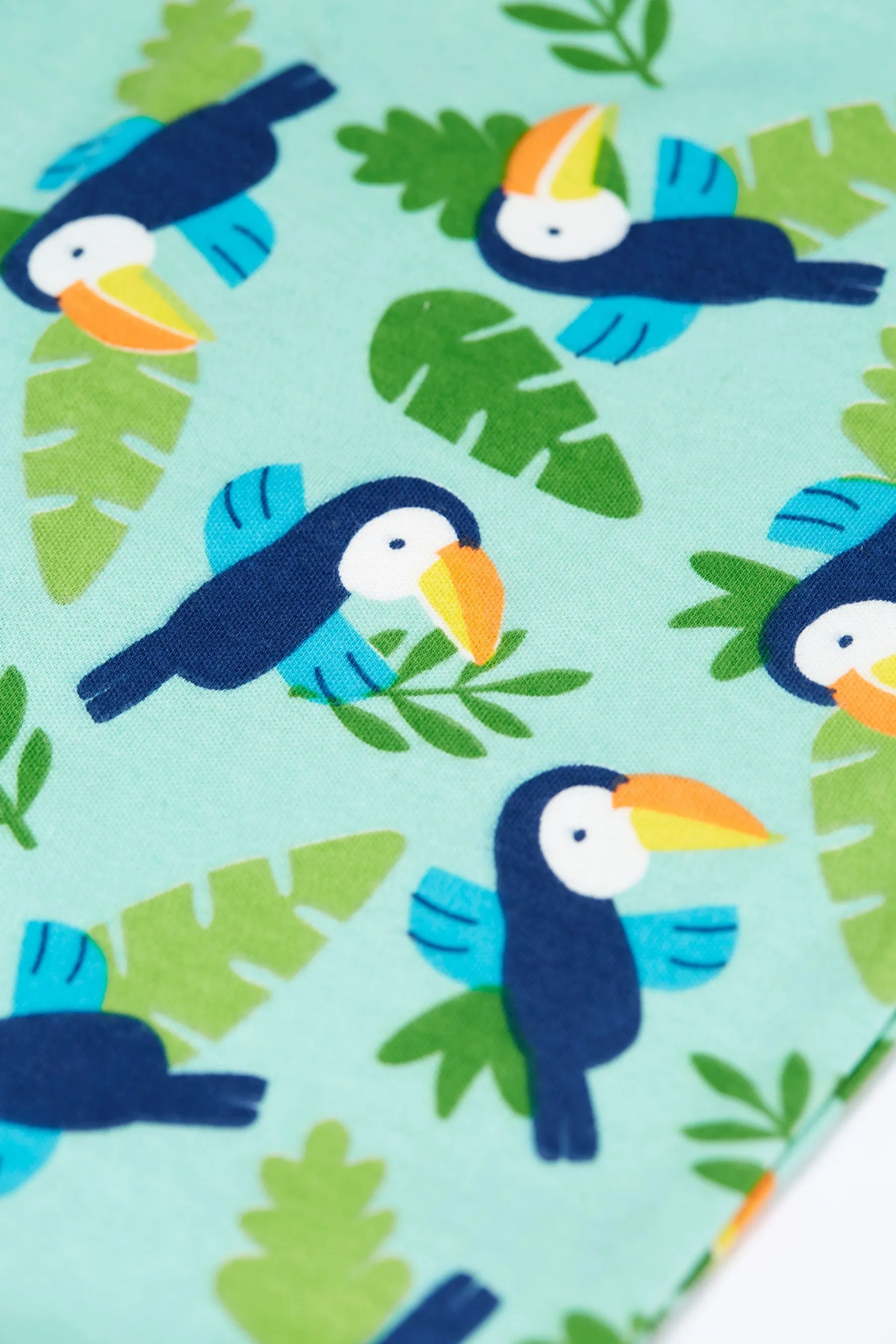 Mono verde con estampado integral de pájaros tropicales de Frugi