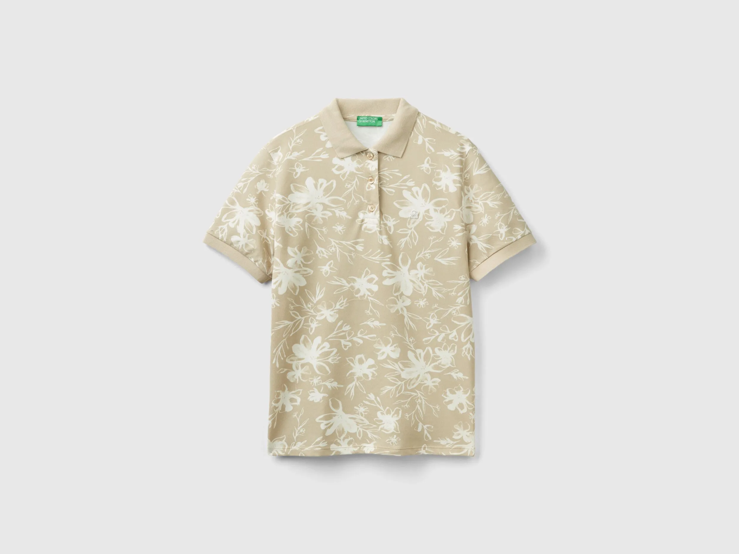 Polo beige con estampado floral