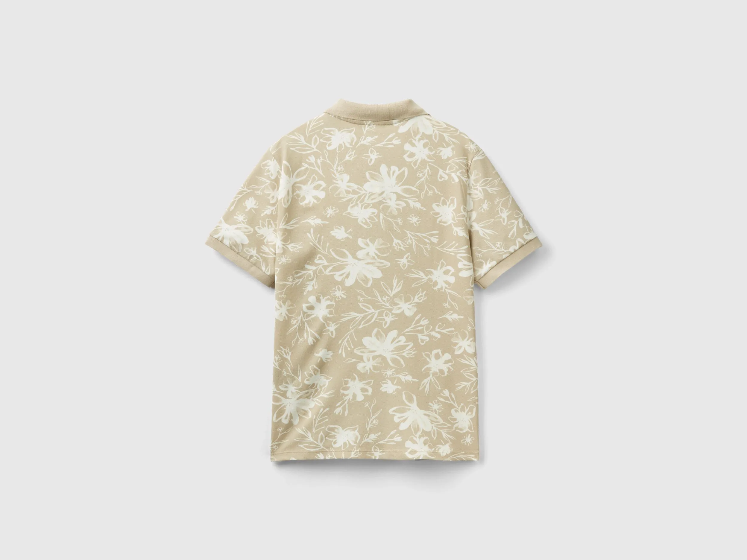 Polo beige con estampado floral
