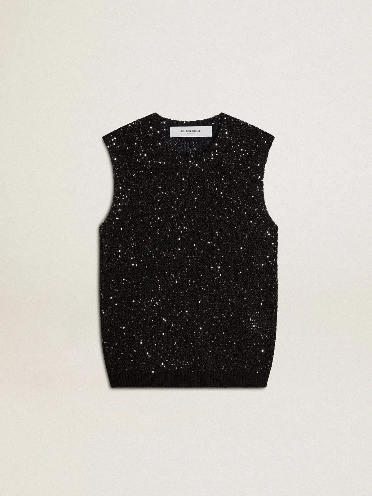 Top de punto de malla negro con lentejuelas y detalles en contraste