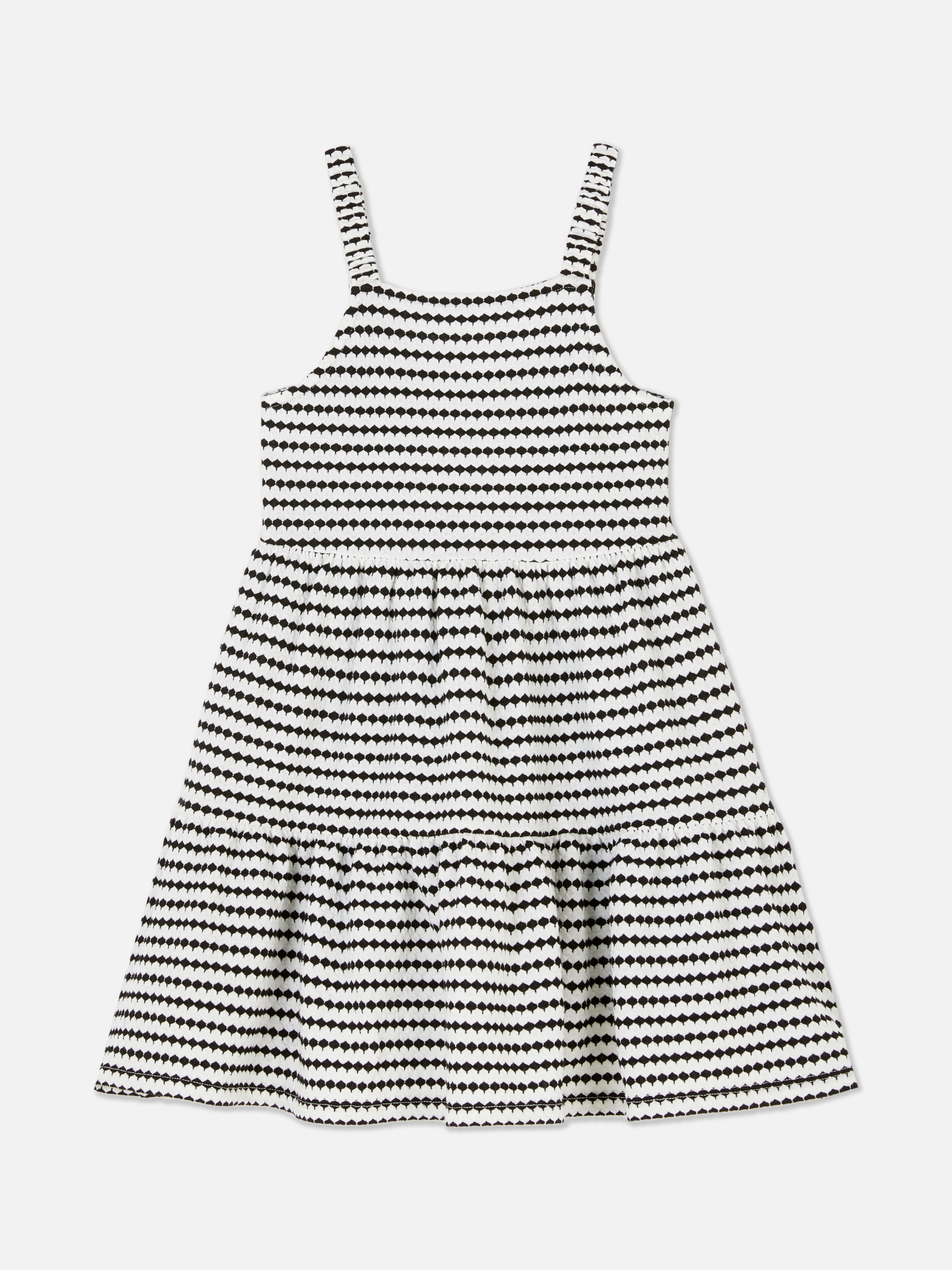Vestido a capas con lazo en la espalda