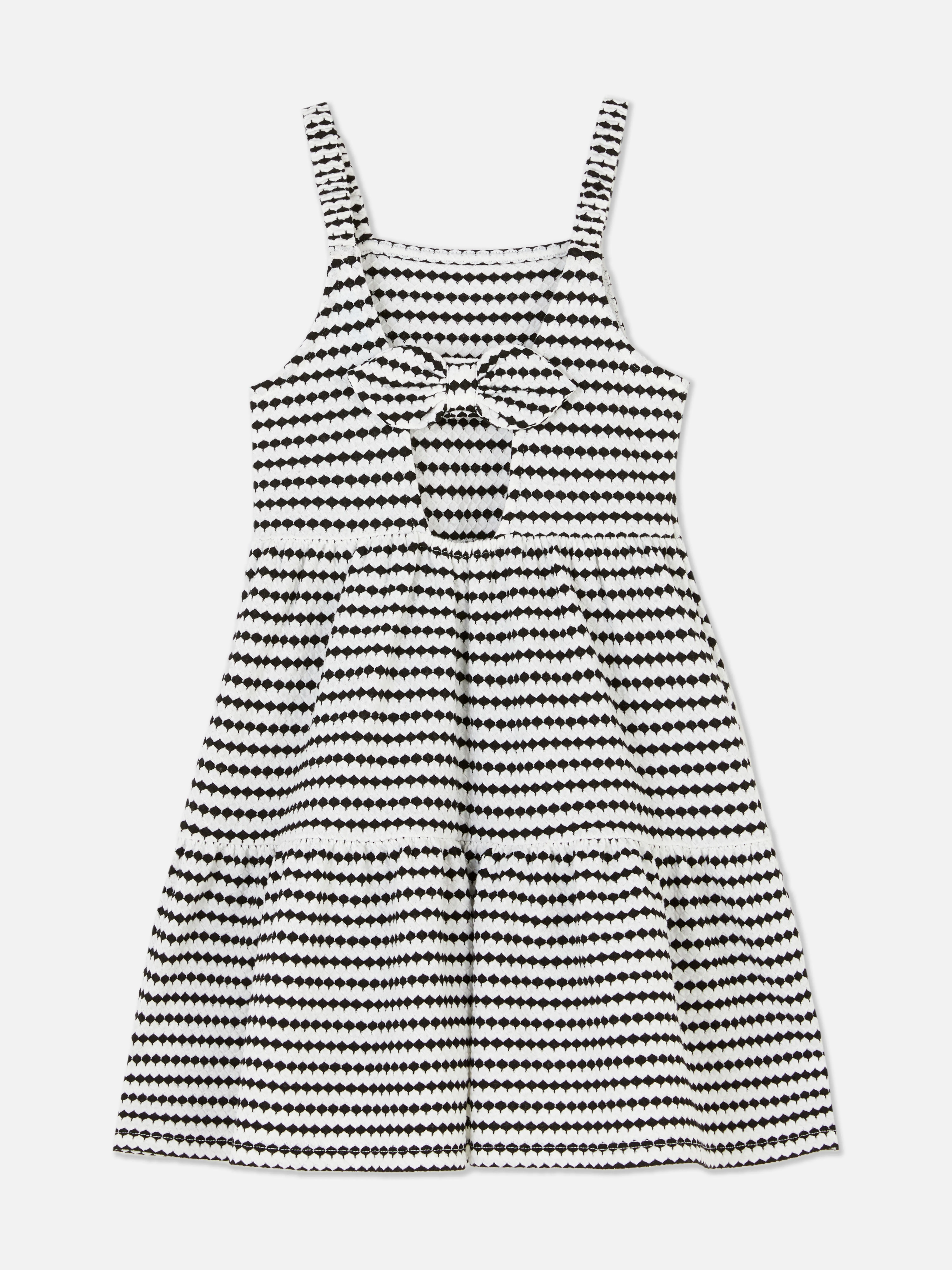 Vestido a capas con lazo en la espalda
